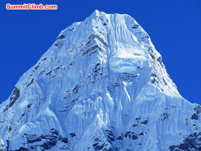 Sunny Ama Dablam summit. Camp 3 is the shoulder on the right. Photo by Mark van 't Hof
