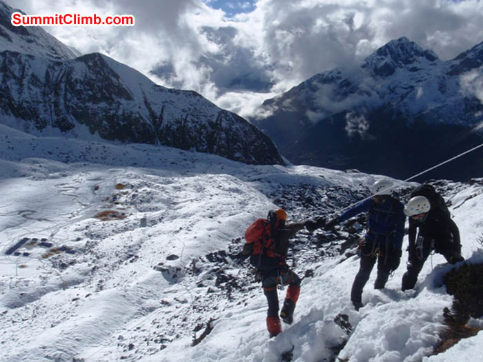 Team practicing abseiling fixed lines above basecamp, seen in left side of photo. James Barritt Photo