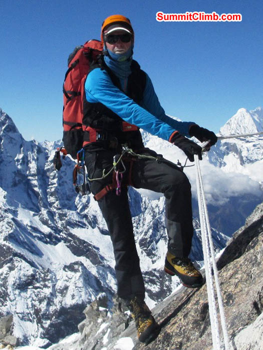 Mark traverses solid granite on the ridge below camp 2. Sarabjit Bhooee Photo.