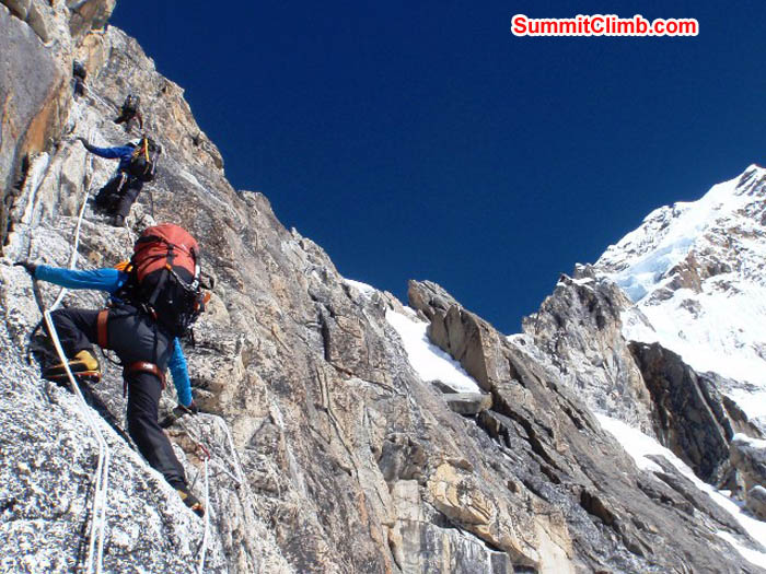 Top to bottom - Tenji, Maggie, Saz, and Mark climbing up to the white tower. James Barritt Photo.