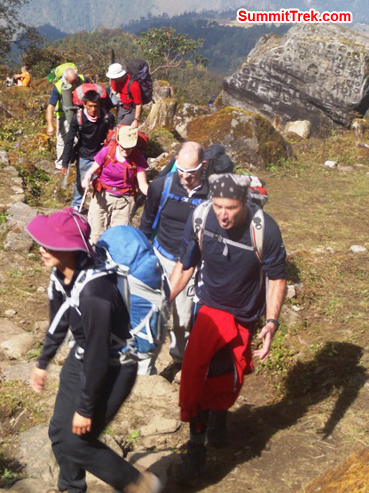 Chu, Milan, Richard, Toni, Chewang, Tony, and Perry, walking up to Kharkhi Teng while Pete takes a breather. Photo by Andrew Davis