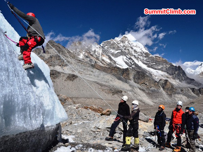 Joe Medina shows off at ice practice while James Kaminski, Shera Sherpa, Joel Kaminski, Richard Cotter, Toni Taylor, and Paul Brophy look on. Photo by Michael Moritz.