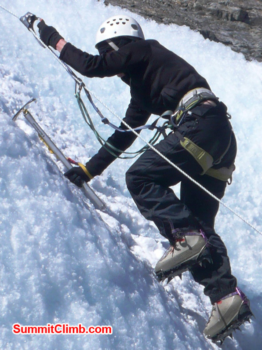 Toni Taylor takes on the practice ice wall at Naulekh Glacier. Photo by Dan Mazur.