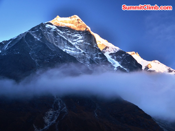 A moody cloud sweeps across the flanks of Mera Peak at sunset one evening. Photo taken from Tagnag Village, by Michael Moritz.