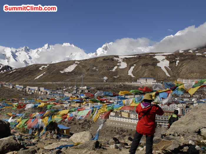 Acclimatization trek, with the prayers flags & Christina Kristensen overlooking Nylam. Matt Taylor photo.