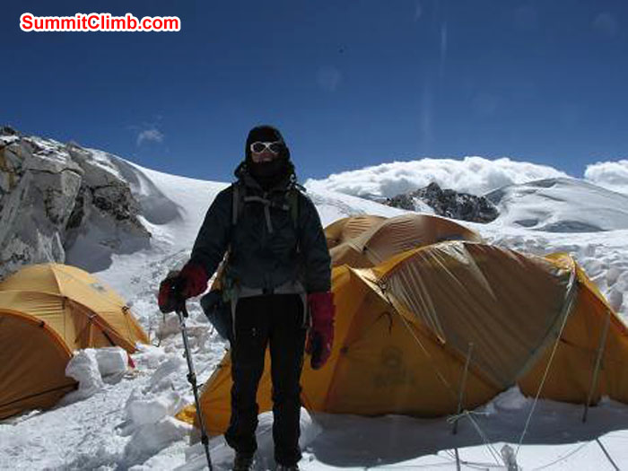 Deb at Camp 1 in front of all the tents. A bit of protection from the winds.Photo John Martersteck Deb at Camp 1 in front of all the tents. A bit of protection from the winds.Photo John Martersteck