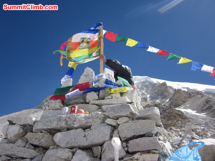 Holding the player flag while Puja ceremony. Photo John & Debbie