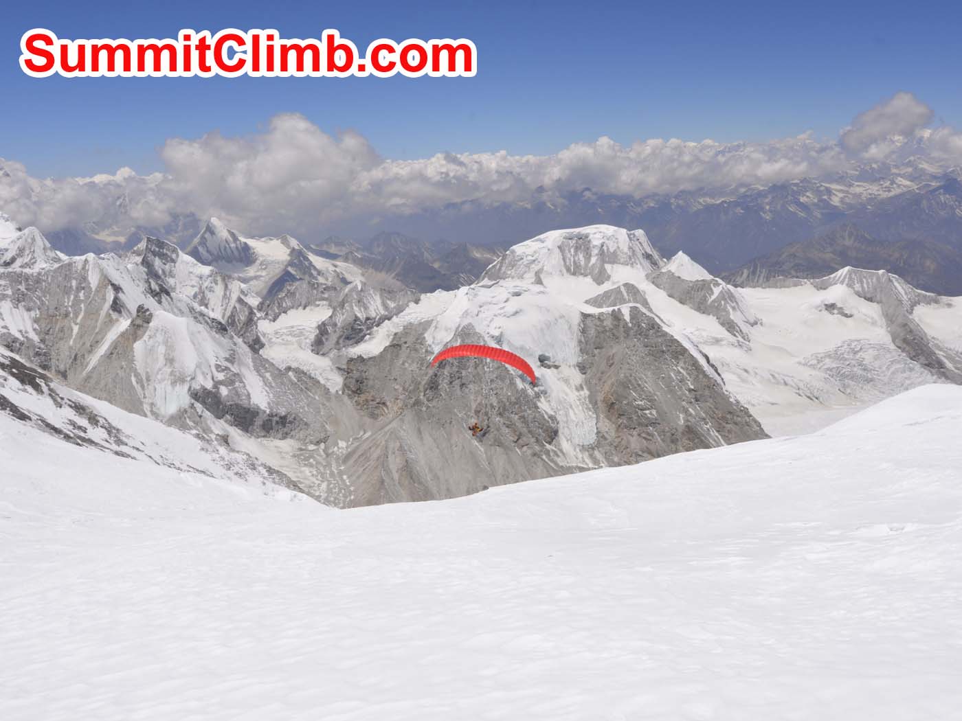 Parachutist on the flight from camp 2. Mount Gyachung Kang in background. Dmitri Nichporov photo