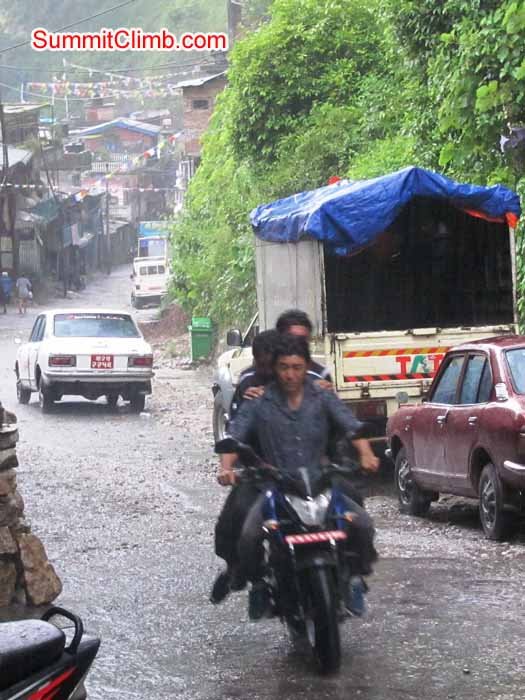Motorbiking in the rain in Kodari, near Tibet border. Troy Bacon Photo