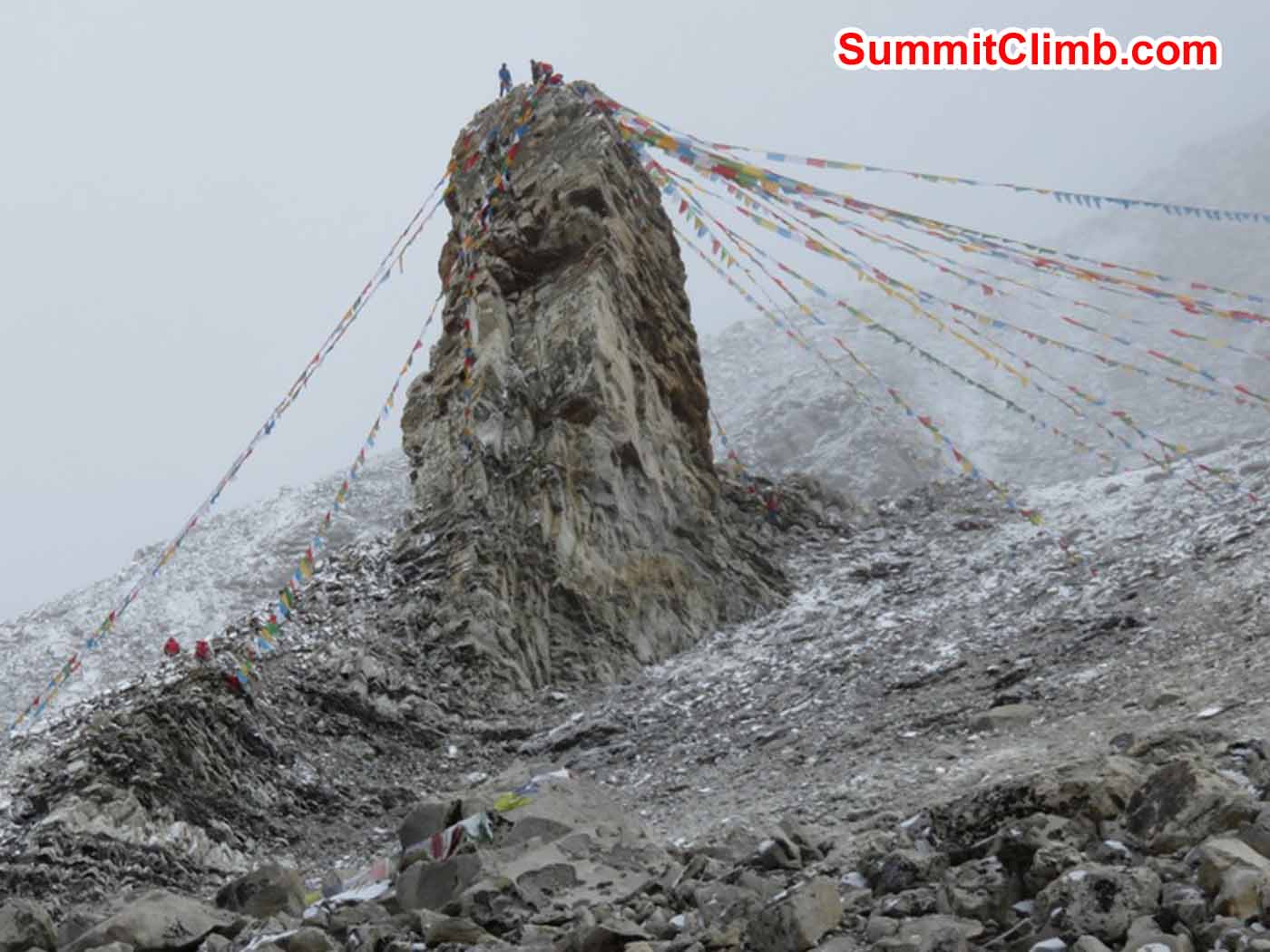 Prayer flags at Advance Base camp with Cho Oyu in the background by Kaley Erickson
