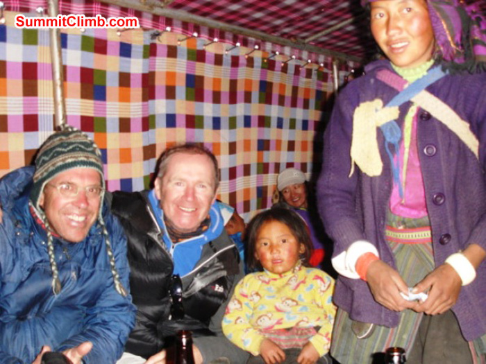 Dan, James, Chutin and Mama Chutin staying warm in the teahouse at Gyepla. James Grieve Photo