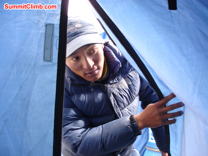 Ang Pasang looks at whats cooking in our dining tent. James Grieve Photo