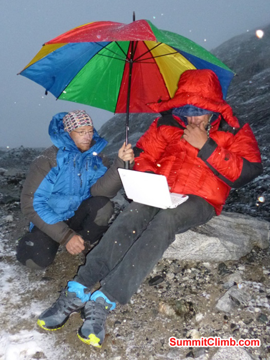 Juergen and Dan using the internet at a point on the trail just below ABC, which has the best reception. JJ Photo