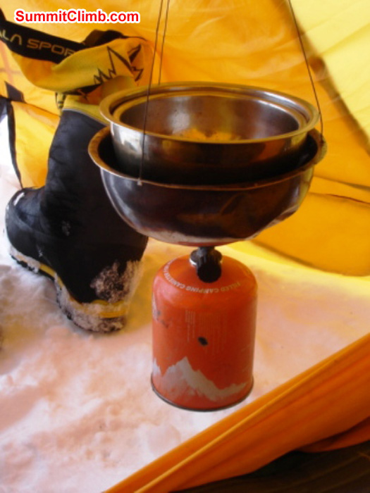 Hanging stove and boot in the vestibule of a comfortable two person tent in Camp 1.5. Photo by James Grieve.