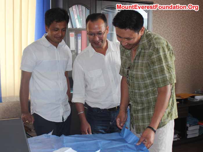 Observing the blue print of Deboche Nunnery. From left Rajendra Pradhan – Engineer, Subodh Shrestha, and Mingma Sherpa. Photo Subodh Shrestha.