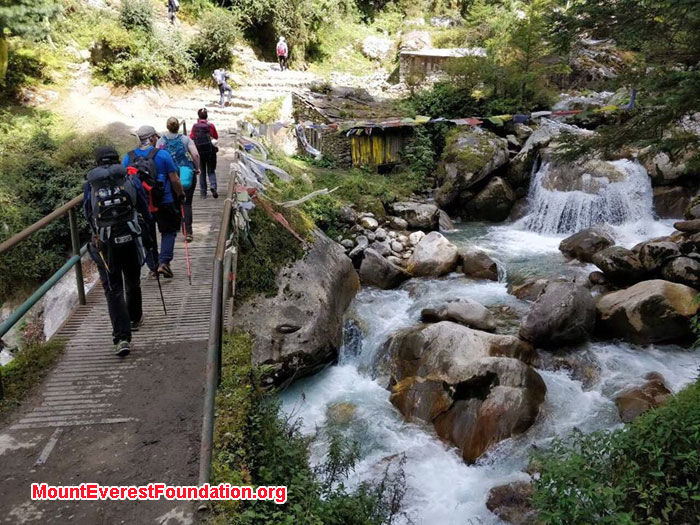 Team and young monks are in tea house