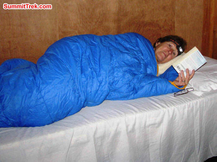 Dee Haberern enjoying a good book and a warm sleeping bag. Photo by Ron Haberern