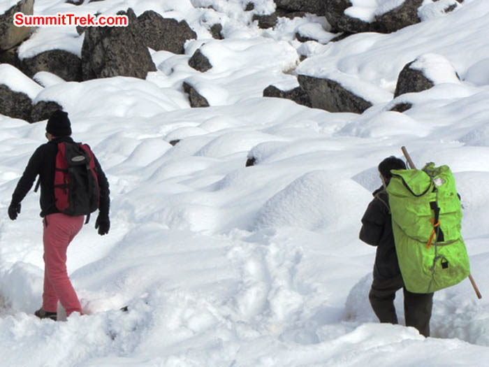 Leonard and his porter trekking back down to Lukla. Mark van 't Hof photo