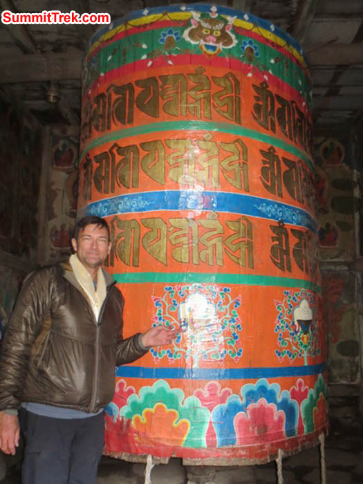Brian Rolfson spins the giant prayer wheel in Pangboche Temple. Photo Hannah Rolfson.