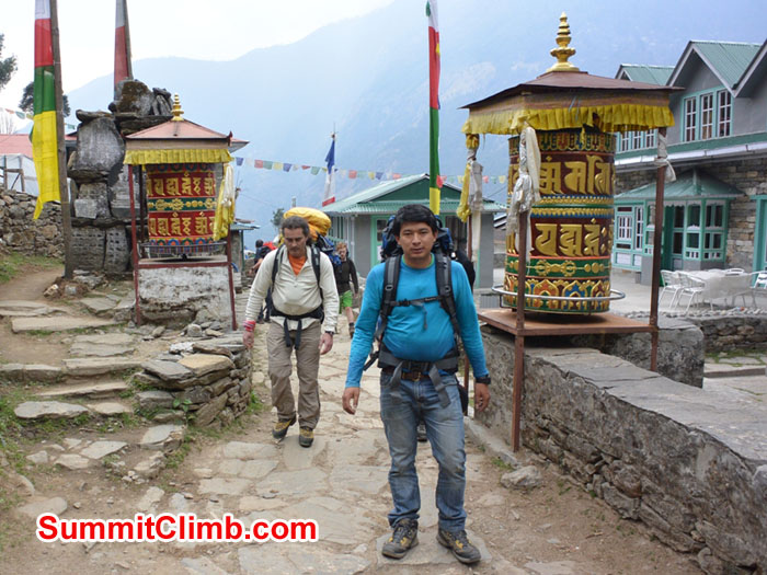 Laxman and Karel crossing through Ghat Village. Photo by Mike Fairman