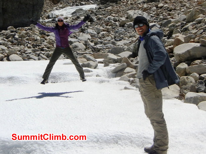 Arnie and Mia looking down at Everest Tibet Basecamp with Everest in upper left, from beginning of ice river - Photo Scott Patch