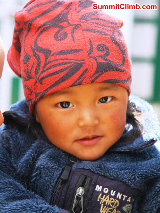 Sherpa child wearing a Mountain Hardwear jacket in Namche. Monika Witkowska Photo. Sherpa child wearing a Mountain Hardwear jacket in Namche. Monika Witkowska Photo.