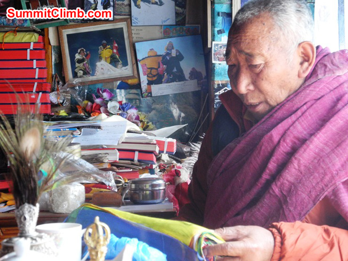 Pangboche's Lama Geshe reading the SummitClimb prayer flags during expedition blessing ceremony. Violetta Pontinen Photo. Pangboche's Lama Geshe reading the SummitClimb prayer flags during expedition blessing ceremony. Violetta Pontinen Photo.