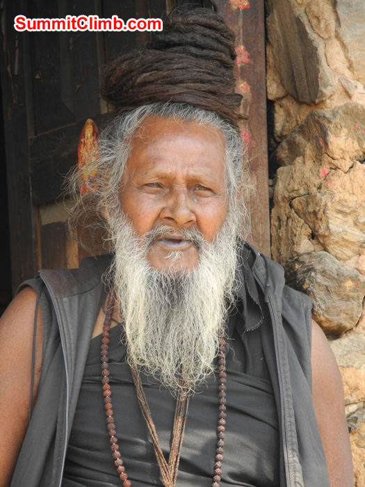 Holy man at the Pashputinath Temple in Kathmandu. His long hair is coiled upon the top of his head. Violetta Pontinen Photo. Holy man at the Pashputinath Temple in Kathmandu. His long hair is coiled upon the top of his head. Violetta Pontinen Photo.
