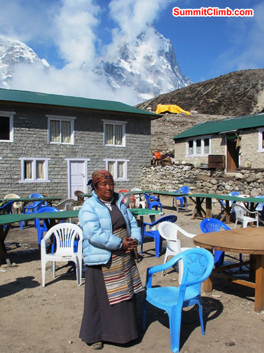 Pasang Sherpani is the boss of the Thughla Lodge. Cholatse in the background. Monika Witkowska Photo. Pasang Sherpani is the boss of the Thughla Lodge. Cholatse in the background. Monika Witkowska Photo.