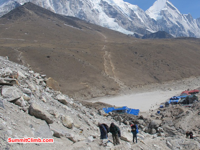 Trekkers reaching Gorak Shep. Lodges and the famous Kala Pattar view ridge in the background. Monika Witkowska Photo.