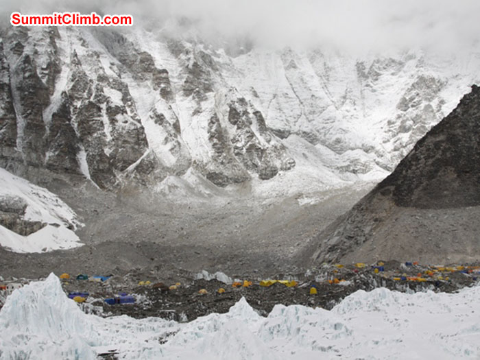 Everest basecamp nestles amongst the tall peaks and the Khumbu Glacier. See the line of glacial recession on the slopes on the right. Monika Witkowska Photo. Everest basecamp nestles amongst the tall peaks and the Khumbu Glacier. See the line of glacial recession on the slopes on the right. Monika Witkowska Photo.