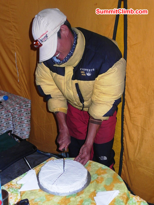Kamal Bahadur cuts the cake on a celebration night in basecamp. Monika Witkowska Photo. Kamal Bahadur cuts the cake on a celebration night in basecamp. Monika Witkowska Photo.