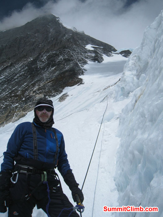 Kieran Lally High On Lhotse Face, with Everest in Background. Scott Smith Photo.