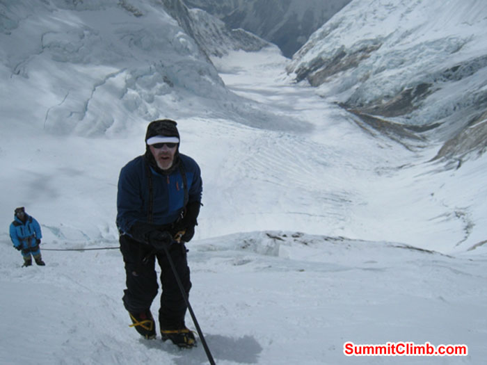 Kieran Lally climbs high above camp 3 on the Lhotse Face. Jangbu Sherpa and Western Cwm in the background. Scott Smith Photo.