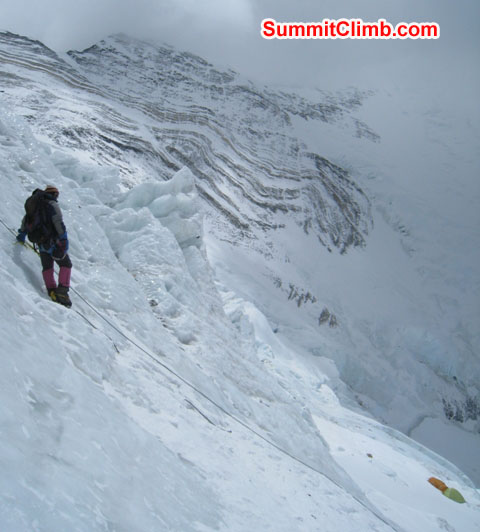 Kieran Lally descends the Lhotse face on fixed ropes. Note the fault lines in background and the tents in lower right. Scott Smith Photo. Kieran Lally descends the Lhotse face on fixed ropes. Note the fault lines in background and the tents in lower right. Scott Smith Photo.