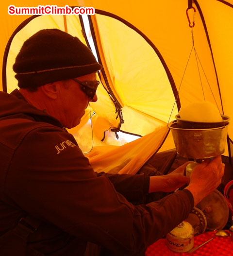 Dan Mazur melts snow in camp 3. Monika Witkowska Photo