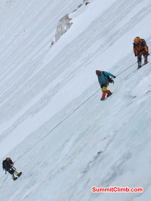 Team climbing the steep Lhotse face to camp 3 at 7000 metres - 23,000 feet. Monika Witkowska Photo. Team climbing the steep Lhotse face to camp 3 at 7000 metres - 23,000 feet. Monika Witkowska Photo.