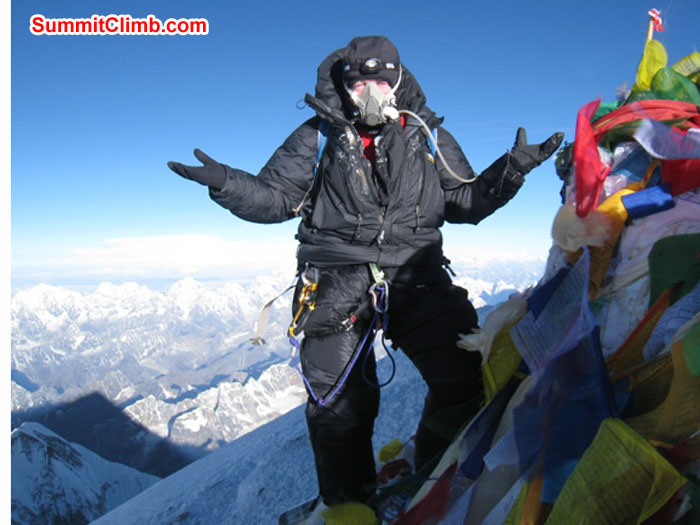 Kieran Lally on the summit. What else would you expect. Everest's summit shadow in lower right. Photo by Scott Smith. Kieran Lally on the summit. What else would you expect. Everest's summit shadow in lower right. Photo by Scott Smith.