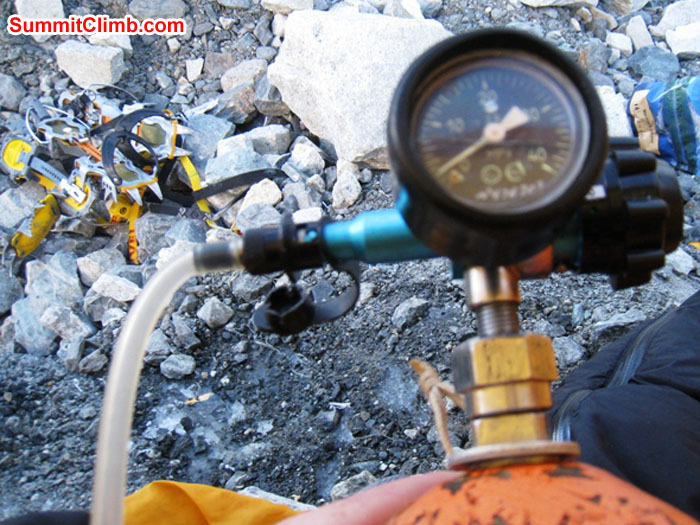 Oxygen bottle, regulator, and gear in camp 2. Scott Smith Photo. Oxygen bottle, regulator, and gear in camp 2. Scott Smith Photo.
