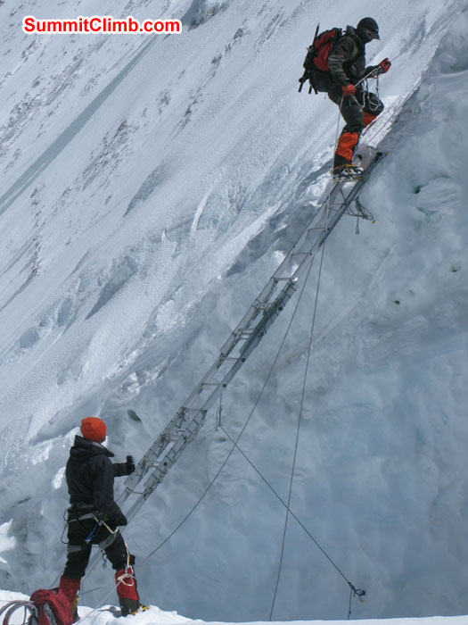Chris Bailley using ladder to ascent while Martin taking a picture of him. Photo Rikke.