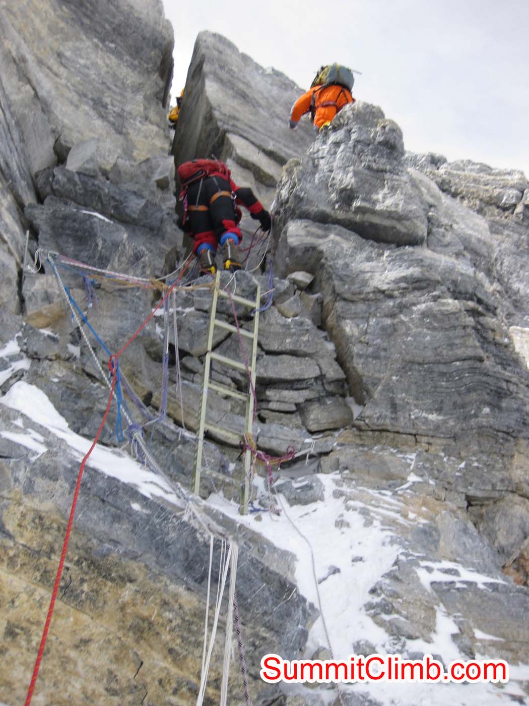 Climber preparing to descend first ladder at second step - Photo Mia Graeffe
