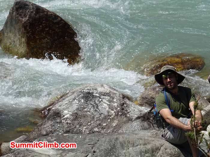 George Kashouh resting by some glacier water on our trek to Namche Bazaar. photograph by James Grieve
