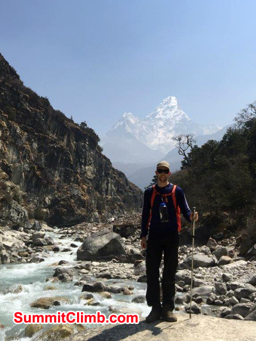 Member posing behind AmaDablam and follow river Dudh Koshi