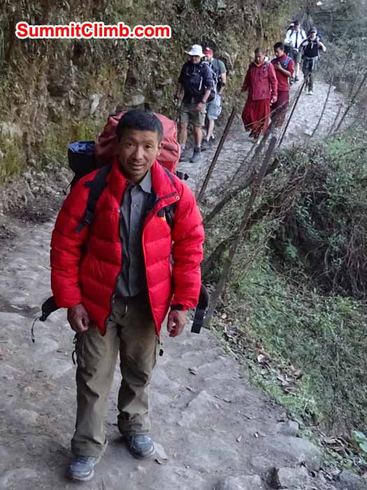 Mingma sherpa leading the climb members on the way to Namche Bazaar. photograph by James Grieve