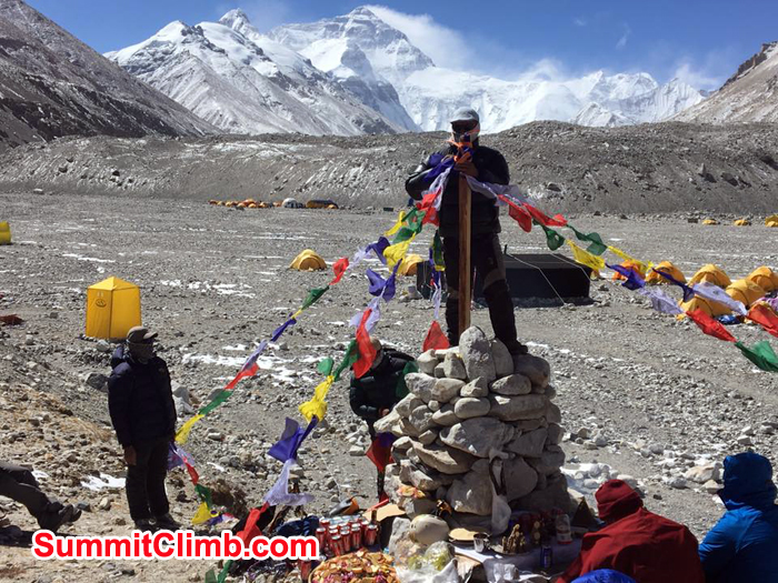 Sherpa trying to put player flag during puja