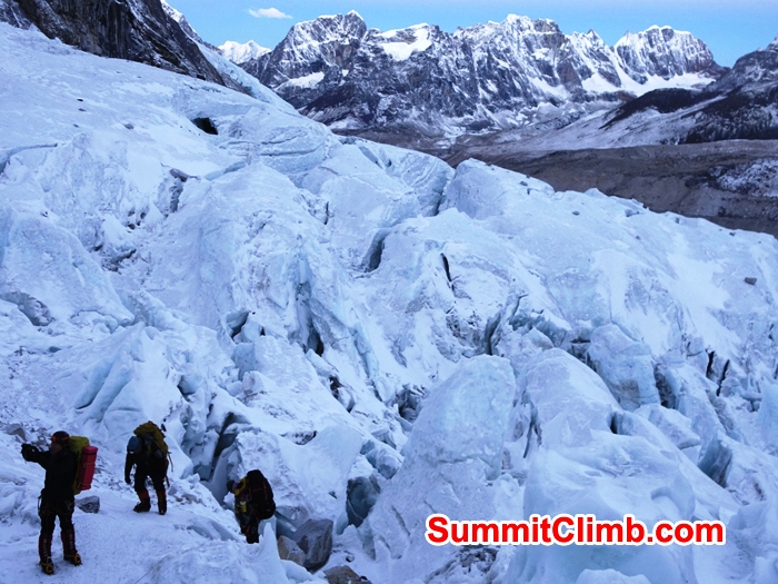 Team climbing up the Khumbu iceall. Mount Lobuche in background. Franz Ruehrlinger Photo