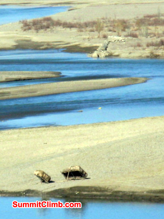 Yak skin boats propped up on side of the Yarlung Tsampo river. Photo by Murari Sharma