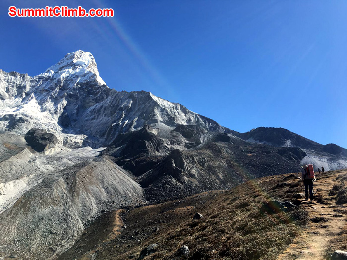 team member with mountain