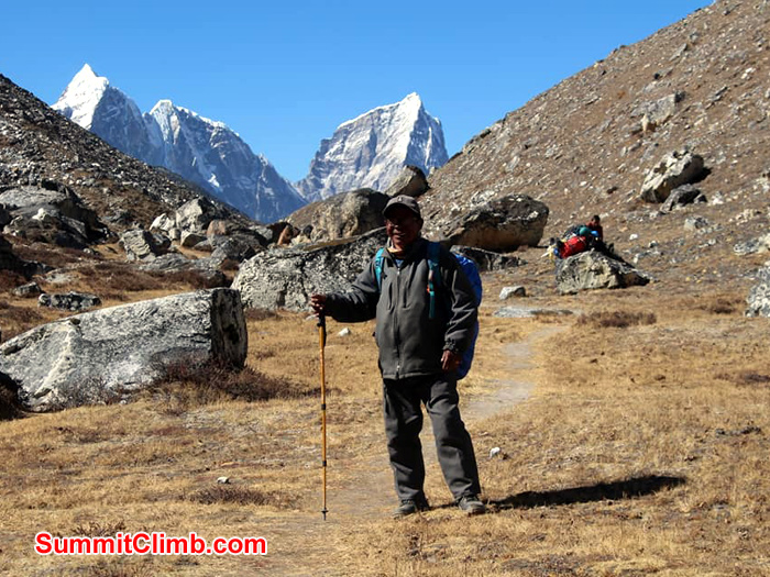 sherpa standing with stick