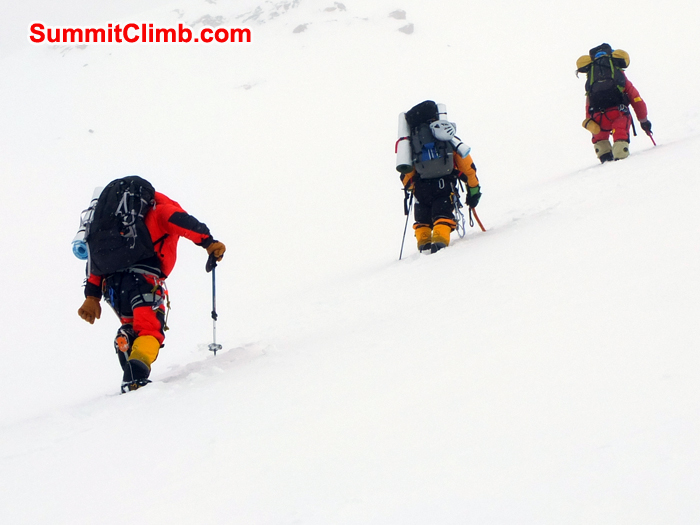 Sherpas ahead (trail breaking ) and the westerners suddenly behind, before the wind covers the trail with snow again